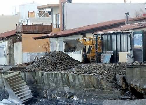 Repairs begin on storm damged taverna promenade, Kolimbari, North West Crete.