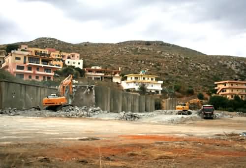 Kolimbari Co-op loses its storage tank buildings to mechanical chisels, November 2008.