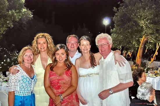 Viv Jones (Lt) and Leigh Jones (Rt) with David & Angeliki (4th & 5th Left) and two other guests at the Wedding Reception in Spilia on July 26th 2008.