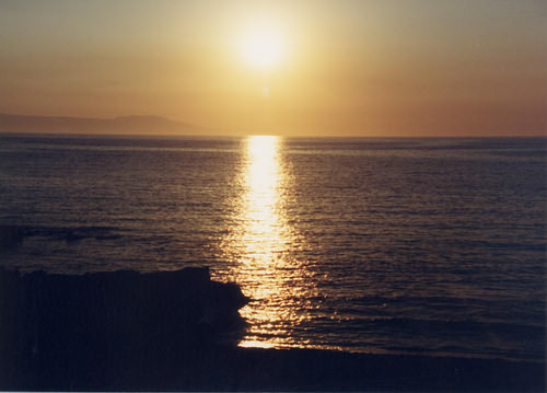 Liquid gold sunset, golden rays on a wine dark sea.  Maybe Homer was here.