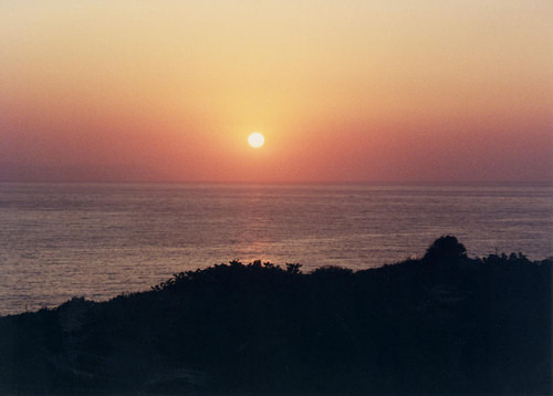An easy, cool sunrise over the bay of Chania, Chania, North Western Crete.