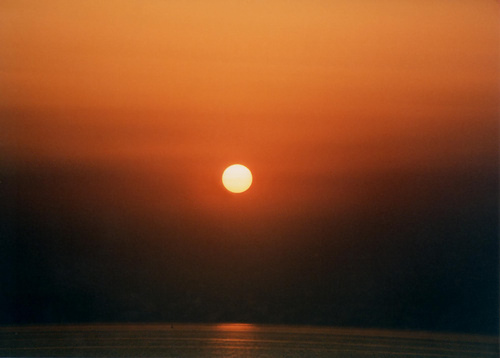 Setting sun over Chania from the Rodopos peninsula. Burnt gold over North Western Crete.