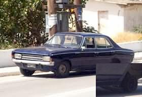 Opel Rekord saloon car, missing rear offside wheel, no jack!